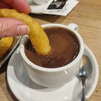 churro dipped in hot chocolate at Tejeringo's Coffee in Malaga