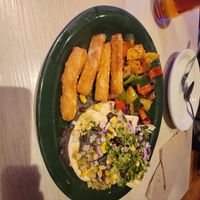 Enfrijoladas with grilled veggies & yucca fries at La Rumba Restaurant Latino in Asheville