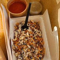 Koshari, baked onions, sauces at Abu Amr Koshari  in Amsterdam