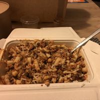 The box with koshari after all the mixture  at Abu Amr Koshari  in Amsterdam