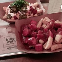 Top left chilli cheese fries, bottom right currywurst fries at Frittenwerk - Alexanderplatz in Berlin
