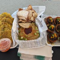 Tostones, hummus and pita chips, alcapurrias at El Cuchifrito in Catano