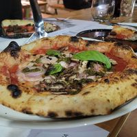 pizza with mushrooms, vegan cheese, onions and pesto at Bigalia in Mendoza