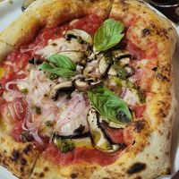 pizza with mushrooms, vegan cheese, onions and pesto at Bigalia in Mendoza