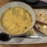 Hearty lentil soup with sourdough bread .  at Mood Cafe in London
