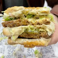 The famous burger - better than a Big Mac! This thick boi is dense!  at Odd Burger in Regina