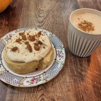 Ginger biscuit roll and chai latte at Busy V Bakery  in Bristol