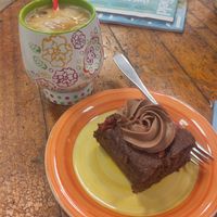 Chocolate and raspberry cake and iced latte at Busy V Bakery  in Bristol