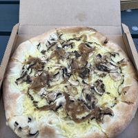 Nr 30. It said it would have tomato sauce on it but it also makes sense as a white pizza. It was decent    at Amigo Pizza in Frederiksberg