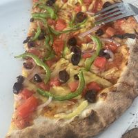 Mediterranean pizza with feta removed & vegan cheese added   at Patio Dining in Vasiliki
