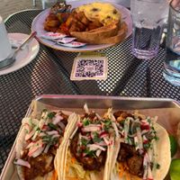 Lower plate is vegan cauliflower tacos. Upper is non vegan breakfast.  at Busboys and Poets - Shirlington in Arlington