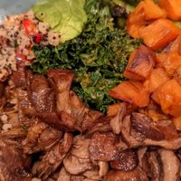 Vegetable Quinoa Bowl

Quinoa, grilled eggplant, asparagus, mushrooms, caramelized sweet potatoes, avocado, red peppers, kale, romesco vinaigrette at Busboys and Poets - Shirlington in Arlington