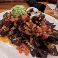 Vegan Nachos

Yellow corn chips, black beans, guacamole, vegan cheese, pico de gallo, vegan sour cream at Busboys and Poets - Shirlington in Arlington
