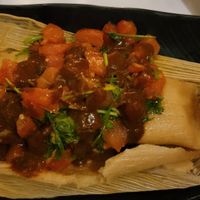 Tamale, one of specials not on menu. Best tamale I ever had! Topped woth a tomato sauce. at Peacefood Cafe - Downtown in New York City