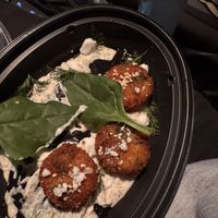 Spinach artichoke arancini with dill feta sauce  at Crossroads Kitchen in Los Angeles