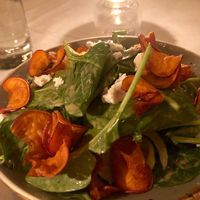 Delicious spinach salad with "cheese" and sweet potatoe chips at Crossroads Kitchen in Los Angeles