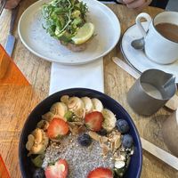 Avo toast and acai bowl   at Oatis in London