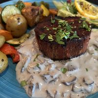 VILET MIGNON, With mushroom cream sauce,
oven vegetables and in baby potatoes fried in their skins, salad bouquet
  at Cafe Harvest in Vienna