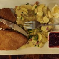 Schnitzel with potato salad and lingonberry at Cafe Harvest in Vienna