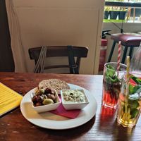 olives, tzatziki and oat bread starter (left) and homrmade lemonades (right) at Cafe Harvest in Vienna