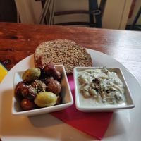 olives, tzatziki and oat bread starter at Cafe Harvest in Vienna