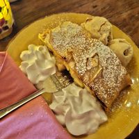 Apple strudel with whipped cream at Cafe Harvest in Vienna
