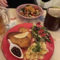 Schnitzel with warm potato salad   at Cafe Harvest in Vienna