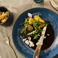 Artisan seitan, garlic potatoes, red wine sauce, veggies and vegan cheese  at Ravintola Brahe in Hameenlinna