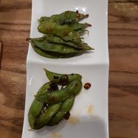 Half eaten peperoncino edamame (a delicious and free side dish) 😋 at The Veggie Table in Sendai