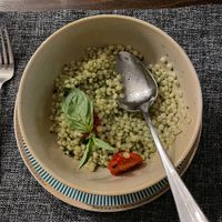 Ptitim with basil pesto and baked tomatoes  at Kuzina in Astana