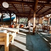 Terrace with a view to mountains and village park at Coffee Kor in Mestia