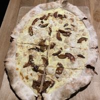 Tarte flambée du moment sucrée: Quetsche, crumble-cannelle, sucre glace  at Mama Bubbele in Strasbourg