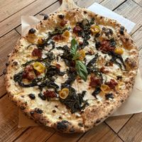 𝐅𝐫𝐢𝐚𝐫𝐞𝐥𝐥𝐢 - White base with Mozzarella (vegan), Friarelli (Italian broccoli), Vegan n’duia, yellow semi-dried Tomatoes, red chilli and fresh Basil   at Pizza by Vinnie - The Oil Basin Brewhouse in Worcester