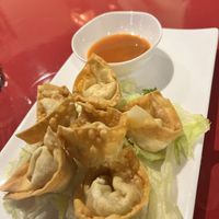 Golden wontons with orange dip sauce   at World Vegan Cuisine in St Petersburg