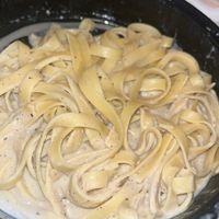 Fettuccine Alfredo ($16.95, buy 1, get 1, on Uber Eats) - “Vegan parmesan infused cashew cream sauce. Served with bread.” 🍝 at 3 Brothers Pizza Cafe in Farmingdale