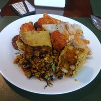 A plate filled with good food at Mahatma Gourmet in Curitiba