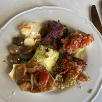 Antipasto misto del giorno con caponata, cous cous, cuori di palma, zucchine fritte con cipolla in agrodolce, bruschette, olive  at Agriturismo Le Arcate in Marsala