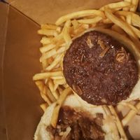 a burger that is doesn't have everything on it to resemble the the town or backyard bbq burgers. and I was supposed to have 2 burgers, only got this one. barely any fries as well at The Happy Hooligans in San Jose