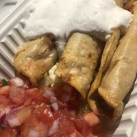 Flautas, the lettuce and tomatoes are separate and not easy to add in but they’re good without   at The Happy Hooligans in San Jose