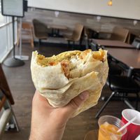 Breakfast Burrito: mostly tater tots & not much flavor. had the spam bacon strips that tasted more like spam than bacon  at The Happy Hooligans in San Jose