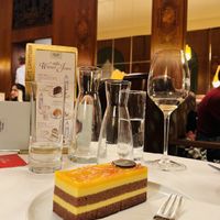 Mangoschnitte (vegan cake with chocolate base, hazelnut cake, mango dairy-free cream and a mango jelly topping!)   at Café Landtmann in Vienna