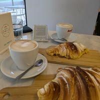 Croissant simple and apple filled croissant. Soya cappuccinos. at O Melhor Croissant da Minha Rua - Alameda in Lisbon