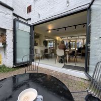 Outdoor seating looking indoors  at Mandala Café in East London