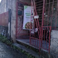 The entrance is on the left side of the building, through the gate at Veganize Bohol in Tagbilaran