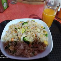Veg fried rice + fresh presses orange juice at Basmati Café in Lisbon