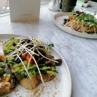 Avocado with chestnut mushrooms and carrot with tahini dressing sandwiches at June  in Tilburg