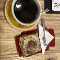 Batch brew (huge) and cinnamon roll.  at Stan Cafe in Plzen