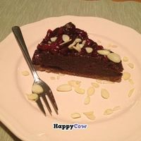 Chocolate cheesecake with berries and almonds at Pod Norenami in Krakow