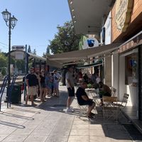 Outside shop: a few small tables for outdoor seating  at Coffee Lab - Sýntagma in Athens