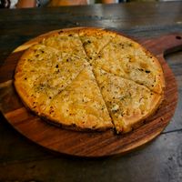 Gluten free vegan cheesy garlic pizza.  at Harry's Beach Bistro in Caloundra